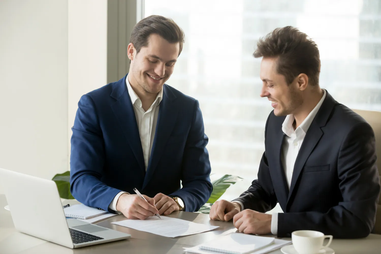 Commercial financing professionals reviewing Vancouver business property documents